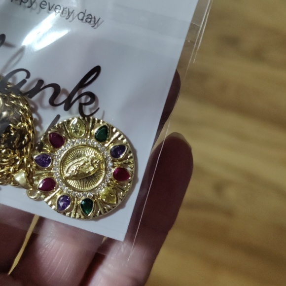 This necklace of the Virgin Mary is multi color and gold the chain is 23 inches - Picture 7 of 7